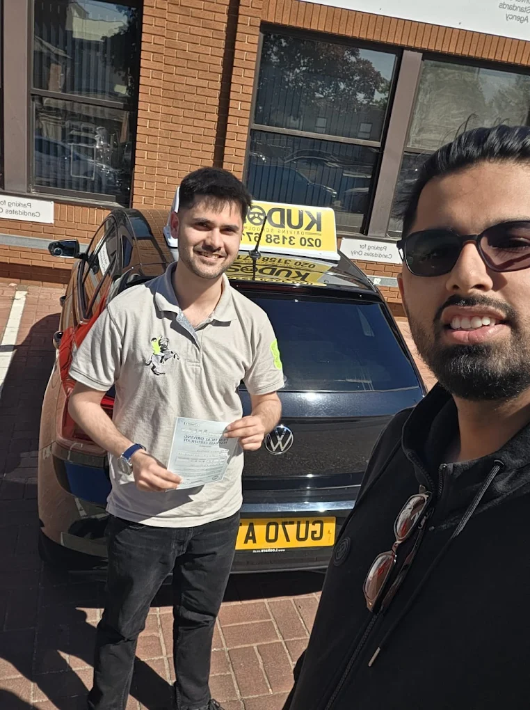 Home 9 Student showing his licence to the camera with a big smile after months of lessons
